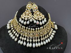 Statement Necklace| Moissanite Polki Necklace set|Indian Wedding Jewelry | Indian Traditional Jewelry set | Necklace Set Material : Silver Gemstone: Moissanite , Red Enamel Stone colour: Uncut polki Primary colour: Gold Size- Necklace length: 550mm Earring length: 65mm Width: 30mm Silver Intricate, hand crafted, Pure Silver Polki Necklace Set , studded with high quality Moissanite Polki Necklace made in 92.5 silver with 22ct gold plating. Product comes with 92.5 silver hallmark. - Product can be Luxury Hallmarked White Bridal Necklace, White Bridal Necklace With Rose Cut Diamonds, Exquisite Round White Bridal Necklace, Elegant White Bridal Necklace With Rose Cut Diamonds, Exquisite White Round Bridal Necklace, Dazzling White Bridal Sets For Wedding, Traditional White Kundan Necklace With Rose Cut Diamonds, Traditional White Diamond Kundan Necklace, White Stone Work Jewelry For Anniversary