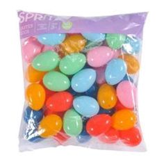 a bag filled with jelly beans on top of a white background