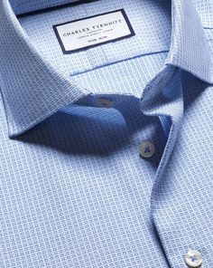 100% cotton with natural stretch, Available in classic, slim and extra slim fit, Non-iron, Semi-spread collar, Classic and slim fit: back pleats, Extra slim fit: back darts, Rounded button cuff with one button, Machine washable - Semi-Cutaway Collar Non-Iron Stretch Texture Grid Shirt - Sky Blue | Men's Charles Tyrwhitt Semi-Cutaway Collar Non-Iron Stretch Texture Grid Dress Shirt - Sky Blue Single Cuff Size Medium Cotton Slim Fit Cotton Shirt With Lapel Collar For Office, Slim Fit Shirt With Lapel Collar For Office, Slim Fit Office Shirt With Lapel Collar, Formal Slim Fit Short Sleeve Tops, Formal Slim Fit Tops With Short Sleeves, Fitted Dress Shirt For Business, Slim Fit Shirt With Welt Pockets For Business Casual, Classic Fitted Shirt With Welt Pockets, Fitted Collared Top With Welt Pockets