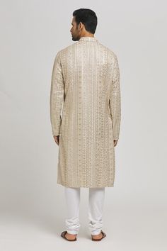 Ivory and gold cotton kurta with sequins and thread embroidery. Comes with churidar. - Aza Fashions Gold Embroidered Chanderi Sherwani, Off White Kurta With Gota Work For Eid, Gold Chanderi Kurta With Intricate Embroidery, Gold Churidar With Intricate Embroidery Straight Kurta, Gold Straight Kurta For Reception, Festive Cream Kurta With Intricate Embroidery, Gold Chanderi Bandhgala With Traditional Drape, Gold Bandhgala In Chanderi With Traditional Drape, Gold Churidar With Intricate Embroidery