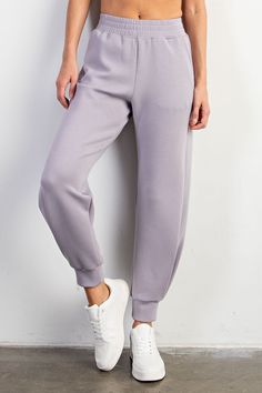 Discover unmatched comfort in our Easy Pull-On Joggers. Designed for effortless style, these joggers boast an elastic waist and luxurious cooling scuba fabric. The bottom side pleat detail adds a touch of elegance, while side pockets enhance functionality. Perfect for lounging, city outings, brunch, and summer adventures, pair these chic joggers with matching tops for a versatile and stylish ensemble. Elevate your wardrobe with comfort and fashion seamlessly combined. Features:- Modal Polyester Solid Color Joggers With Elastic Waistband, Relaxed Fit Pull-on Joggers, Solid Sweatpants With Loosely Fitted Hips And Tapered Leg, Joggers With Elastic Side Panels In Solid Color, Solid Trousers Sweatpants For Jogging, Solid Trousers-style Sweatpants For Jogging, Loungewear Joggers With Side Pockets, Solid Color Joggers With Side Pockets For Loungewear, Spring Sweatpants With Elastic Waistband For Jogging