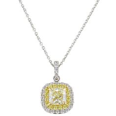 If you've always wanted to add yellow diamonds to your collection, then look no further. A square modified brilliant cut-cornered (radiant) 1.04 carat Natural Fancy Light Yellow Diamond with even color distribution is delicately set with four prongs in the center of this 18k white and yellow gold pendant. Smaller round yellow and colorless diamonds form a double tiered halo perimeter and cascade upwards towards the bail of this magnificent pendant which slides freely on an 18" long white gold ca Yellow Diamond Square Cut Jewelry, Yellow Diamond Jewelry With Princess Cut, Yellow Diamond Fine Jewelry Necklace, Yellow Cushion Cut Diamond Jewelry, Yellow Diamond Necklace In Fine Jewelry Style, Yellow Radiant Cut Fine Jewelry, Fine Jewelry Yellow Diamond Necklace, Yellow Princess Cut Diamond Jewelry, Elegant Yellow Square Cut Jewelry