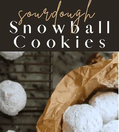 some snowball cookies sitting on top of a wooden table with text overlay that reads sourdough snowball cookies