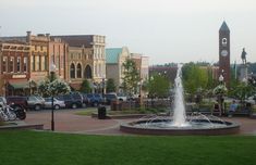 a fountain in the middle of a town square