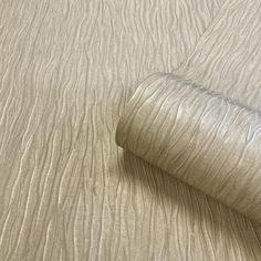 a close up view of a bed sheet with wavy lines on the sheets and bottom