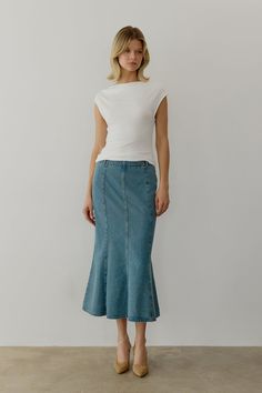 Information The Aeris Skirt is a mermaid denim midi skirt designed with a mid-rise and fit-and-flare silhouette for a flattering look. Perfect to pair with your favorite everyday tee or an elevated blouse. Details 100% Cotton Side Metal Zipper Closure Mid Waist Fit and Flare Midi Length Non Stretch Denim Kara is 5'10" and wearing a size SMeasurements: 32" Bust, 24.5" Waist, 34.5" HipsStyle #SM5130 Blouse Details, Denim Midi Skirt, Winter House, A Mermaid, Skirt Design, Metal Zipper, Online Branding, Lifestyle Brands, Midi Length