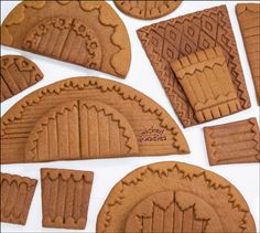 some cookies that are shaped like archs on a white surface with the words wicky goodies