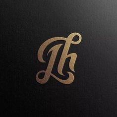 the letter h is made up of gold foil and has an elegant, ornate design