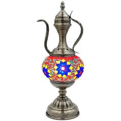 a silver vase with a colorful design on it