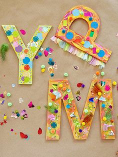 the word may spelled out with colorful paper and confetti scattered all over it