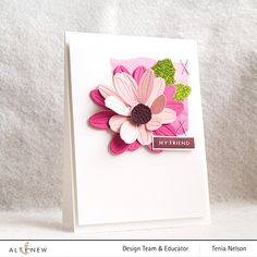 a close up of a greeting card with a flower on the front and back side