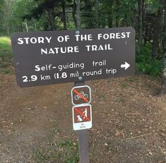 a sign that says story of the forest nature trail