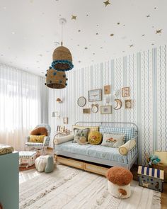 a living room filled with furniture and lots of stars hanging from the ceiling above it