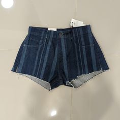 High Rise Dark Denim Shorts With Lighter Denim Strips. Raw Hems With Side Slits. New With Tags, Never Worn. Levi's Denim Blue Summer Bottoms, Trendy Levi's Blue Jean Shorts, Trendy Blue Levi's Jean Shorts, Levi's Denim Summer Shorts, Levi's High Waist Bottoms With Frayed Hem, Levi's Blue Shorts With Frayed Hem, Levi's Denim Jean Shorts For Summer, Levi's Denim Blue Jean Shorts For Summer, Levi's Blue Jean Shorts For Summer