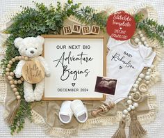 baby announcement with teddy bear and other items