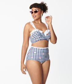 This sweet swim top boasts multicolor florals throughout a navy blue and white gingham pattern, complete with a flirty ruffle along the neckline and straps. The molded cups, side boning, and underwire offer support while adjustable spaghetti straps and lace up back provide a flattering fit!This Is Not A Set. Bottoms Sold Separately.Available in sizes XS-3X while supplies last. 1940s Swimwear, 50s Swimwear, Pinup Bathing Suit, Lana Core, Uv Clothing, Blue And White Gingham, Vintage Swim, Navy Gingham, Vintage Swimsuits