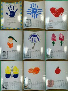 many handprints are displayed on the wall in front of a bulletin board with writing