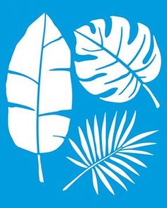 three white tropical leaves on a blue background