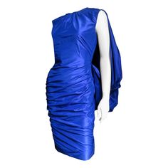 This is a gorgeous cobalt blue silk dress by Tom Ford. It is sleeveless, semi fitted with a horizontally ruched skirt. The back is scooped with a fabulous hip length gathered drape emanating from it creating a cape effect. The dress is fully lined in matching silk with a hidden black zipper. Fits sizes Small, Medium. Bust Open Waist 28" Hips 37" Length 39" Tom Ford Dress, Marilyn Monroe Dress, Blue Silk Dress, Ruched Skirt, Dress Robes, Blue Silk, Ruched Dress, Costume Design, Dress Blue