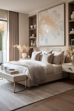 a bedroom with a large painting on the wall above the bed and an ottoman in front of it