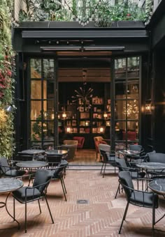 tables and chairs are set up outside the restaurant