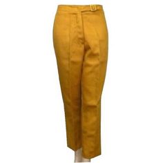 If you are looking for the world's cutest Mod Capri Pants, you have just found them! Capri's were introduced by fashion designer Sonja de Lennart in 1948 and were popularized by her and English couturier Bunny Roger. The name of the pants is derived from the Italian isle of Capri, where they rose to popularity in the late 1950s and early 1960s. These 1950s vintage capris are a dark mustard yellow and have a high waist. They are made of ribbed 100% fine cotton. They feature a stylish extended waistband that acts like a belt with the most delightful buckle to finish the international traveler's look. The WPL# 10360 dates these to the mid-1950s. Tagged vintage size: 14 but these are a modern size equivalent Small, 6  Actual measurements:  Waist 27 inches  Hips 40 inches  Front rise 11 inches Retro Formal Bottoms For Fall, Vintage Knee-length Formal Bottoms, Vintage Formal Spring Pants, Fitted Vintage Bottoms For Formal Occasions, Vintage Style Fitted Flat Front Pants, Fitted Vintage Pants With Flat Front, Fitted Vintage Style Pants With Flat Front, Vintage Fitted Pants With Flat Front, Fitted 1950s Style Bottoms