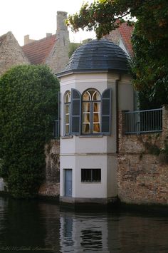 a house on the side of a river