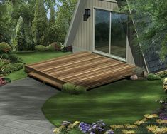 a wooden deck in front of a house surrounded by greenery and flowers on the lawn