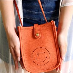 Very Cute Casual Orange Mobile Phone Bag, Casual Orange Shoulder Bag With Mobile Phone Holder, Casual Orange Shoulder Bag With Phone Holder, Casual Phone Bag For Everyday Use In Spring, Casual Orange Shoulder Bag With Phone Pocket, Casual Summer Phone Bag With Removable Pouch, Casual Red Phone Bag With Removable Pouch, Casual Red Phone Bag With Adjustable Strap, Casual Red Phone Bag For Daily Use