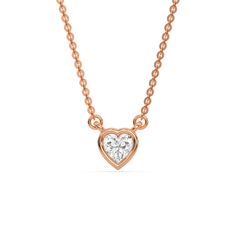 Heart Solitaire Diamond Necklace made with a heart cut diamond in bezel setting with adjustable chain. Details: - Made to Order- Diamond Weight: 0.10 CT, 0.20 CT, 0.30 CT, 0.40 CT, 0.50 CT, 0.75 CT, 1.00 CT- No of Diamonds: 1- Diamond Cut: Heart- Diamond Type: Natural Diamond- Diamond Clarity: SI (0.10 CT - 0.40 CT), VS (0.50 CT - 1.00 CT)- Diamond Color: GH- Setting Type: Bezel- Chain Length: 14-18 Inch- Metal Type: 14K Solid Gold,18K Solid Gold- Choice of Gold Color: Yellow Gold, White Gold, R Fancy Color Diamond Ring, Solitaire Diamond Necklace, Colored Diamond Rings, Halo Necklace, Solitaire Necklace, Diamond Solitaire Necklace, Halo Earrings, Heart Diamond, Halo Earrings Studs