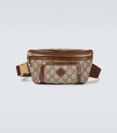 Crafted in the label's iconic GG Supreme canvas, this beige belt bag from the Gucci Aria collection has brown leather trims and golden hardware details. Brown Leather Gucci Belt Bag, Gucci Brown Leather Belt Bag, Luxury Coated Canvas Belt Bag For Everyday, Luxury Belt Bag With Removable Pouch In Coated Canvas, Luxury Leather Trim Belt Bag For Travel, Luxury Belt Bag With Leather Trim For Travel, Luxury Travel Belt Bag With Leather Trim, Gucci Leather Belt Bag With Removable Pouch, Luxury Brown Belt Bag With Removable Belt