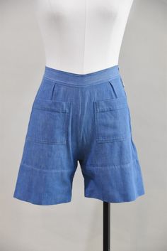 "Vintage 1940s high waist denim shorts. Front five inch square pockets, wide hem, and pleats in back. Side metal zip and button closure. State of garment | very good, light overall wear with a few faint spots (one in rear and one on waistband). Measurements ✂--- best fit | Extra Small / Small waist | 25\" hips | up to 36\" total length | 15\" tag | A Buchler ★★Visit The Shop★★ http://www.etsy.com/shop/seaofvintage ➸ Find the shop on Twitter & Instagram for peekaboo sales & other earthly treasure Light Wash Bermuda Shorts With Pockets, Light Wash Shorts With Pockets, Medium Wash Wide Leg Shorts With Built-in Liner, Medium Wash High-waisted Bermuda Shorts With Pockets, Retro Denim Blue Shorts With Pockets, High Rise Light Wash Bermuda Shorts With Pockets, Vintage Relaxed Fit Shorts With Pockets, Relaxed Fit Wide Leg Shorts With Belt Loops, Retro Light Wash Shorts With Pockets