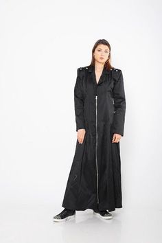 "Black Maxi Coat, Women Warm Coat, Steampunk Trench Coat ♛ All of Rosche's pieces are created with the sole purpose that YOU feel beautiful! Enjoy unique details in combination with high-quality materials every day and make a statement every place you go! ♛ Extravagant and casual at the same time. Comfortable and stylish. The floor length makes it look different and unique. Avant garde piece. Wear it both: with your sneakers or high heels. Long zipper closure. ♛ Perfect for every occasion! ♛ Cus Gothic Biker Jacket For Alternative Fashion, Edgy Black Biker Jacket For Halloween, Black Biker Jacket For Halloween, Punk Style Black Biker Jacket For Halloween, Long Sleeve Outerwear For Cosplay Events, Black Long Sleeve Biker Jacket For Halloween, Gothic Streetwear Outerwear With Rivets, Edgy Long Sleeve Biker Jacket For Cosplay, Black Biker Outerwear For Halloween