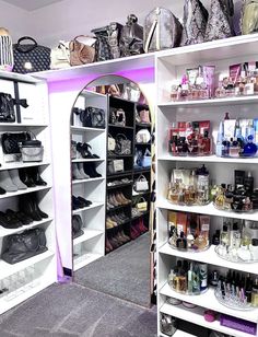 a room filled with lots of different types of purses and handbags on shelves