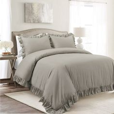 the comforter is made up with ruffles on it