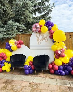 balloons and chairs are arranged in front of a mailbox