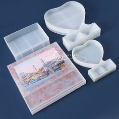 three plastic trays with different shapes and sizes, one is shaped like a heart