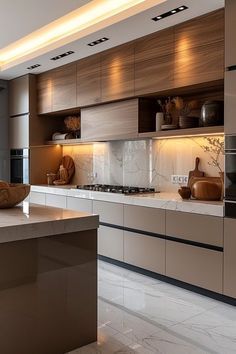 a modern kitchen with marble counter tops and stainless steel appliances