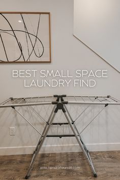 an ironing board with the words best small space laundry find on it in front of a staircase