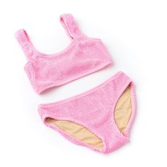 Moms, heres a bikini your little girl will love - especially if shes the girly type! The Pink Girls Crinkle Textured Bikini is perfect for playtime fun in the pool or ocean. The trendy pink crinkle texture adds a fun and stylish look, while providing enough coverage to make sure your daughter stays comfortable and secure. It also comes in sizes 4-14, so there's something for every age group. Made with soft fabric, the two-piece swimsuit is designed for lasting durability and comfort. Let her mix up her beach style with this unique crinkle bikini!

Textured Crinkle Detailing
Fully Lined for Comfort
Flat Zig Zag Stitching
Full Cut Coverage
Designed in the USA
Imported
93% Polyester 7% Spandex
UPF50+ Sun Protective Fabrics In The Pool, Comfortable Flats, Girly Girl, The Pool, Beach Style, Zig Zag, Pink Girl, Soft Fabric, Soft Fabrics