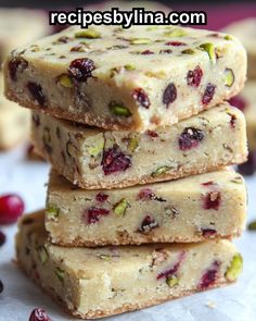 cranberry pistachio bars stacked on top of each other