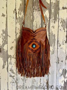 Experience the luxury of our Gypsy Feather hand-tooled fringed leather boho bag. This stunning bag features an adjustable hand tooled strap for cross body wearing and made from genuine lush leather. The main compartment secures with a magnetic close, and inside you'll find one zip pocket and one large open pocket. There's also a back zip pocket for plenty of storage. Feel free to express yourself with a timeless piece that never goes out of style. Measurements :Approx W33cm x H28cm Please keep i Boho Bag, Eclectic Style, Perfect Bag, Out Of Style, Hand Tools, Leather Handmade, Timeless Pieces, Everyday Fashion, Cross Body