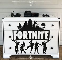 a white dresser with the words fortnite on it and silhouettes of soldiers