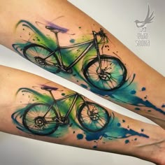 two watercolor tattoos on the legs of people with bicycles painted on their thighs and feet