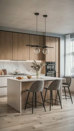 a kitchen with wooden cabinets and white counter tops next to an island in the middle