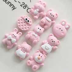 there are many pink teddy bears on this cake topper set, each with different shapes and sizes