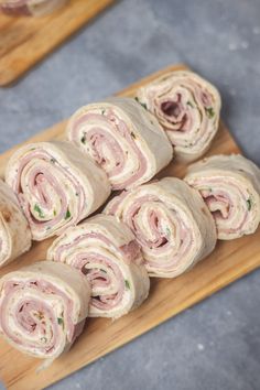 there are many rolls on the cutting board