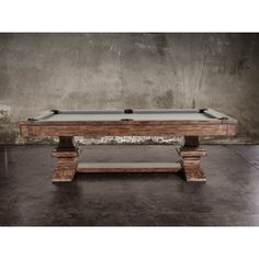 a pool table made out of wood and concrete