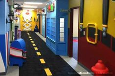 the hallway is painted bright blue, yellow and red with pirate decorations on the walls