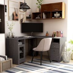 a desk with a chair and computer monitor